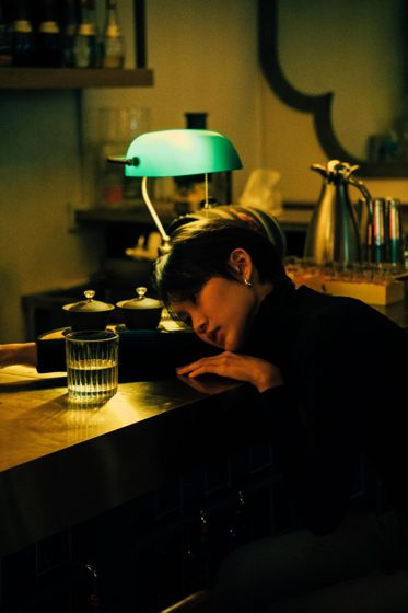 Thảo, Night bar, black turtleneck, frame 1 of 6