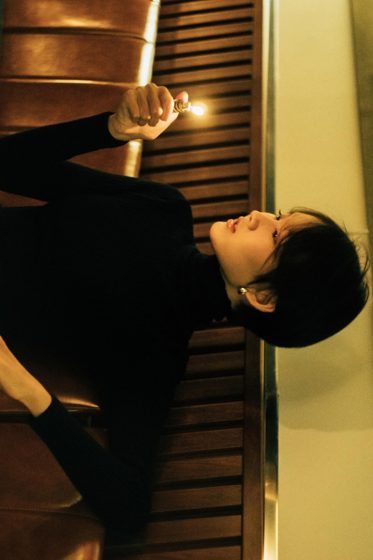 Thảo, Night bar, black turtleneck, frame 3 of 6