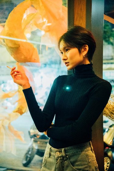Thảo, Night bar, black turtleneck, frame 4 of 6