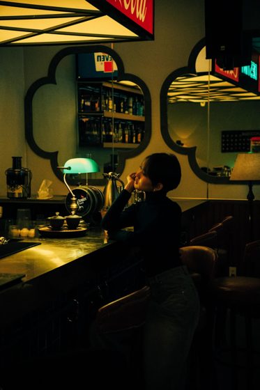 Thảo, Night bar, black turtleneck, frame 5 of 6