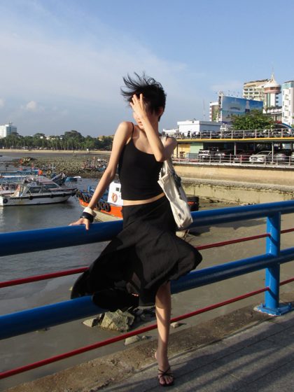 Thảo, The pier, black dress, frame 4 of 7