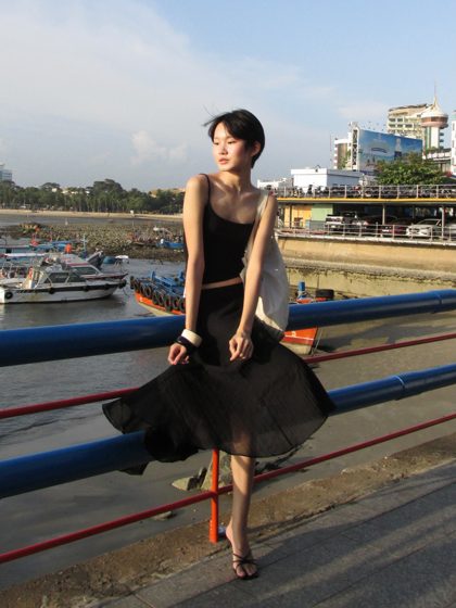 Thảo, The pier, black dress, frame 7 of 7