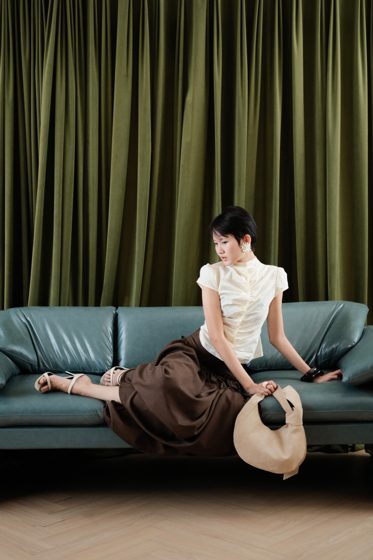 Thảo, Teal sofa, frame 2 of 4