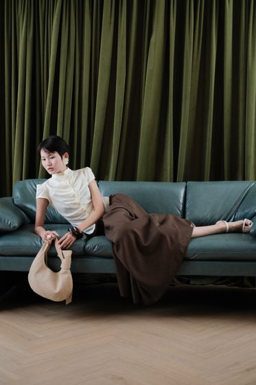 Thảo, Teal sofa, frame 4 of 4
